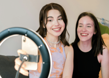 2 women taking a short video of themselves